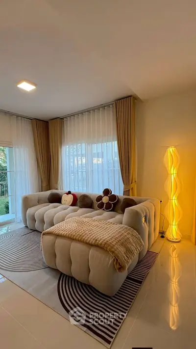 Luxurious living room with plush sofa and elegant lighting