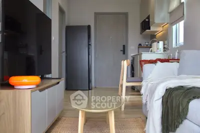 Modern compact living room with open kitchen and cozy decor