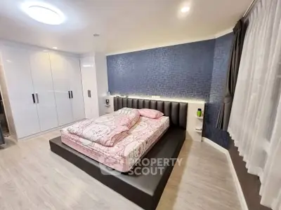 Luxurious modern bedroom with stylish decor and ample storage space