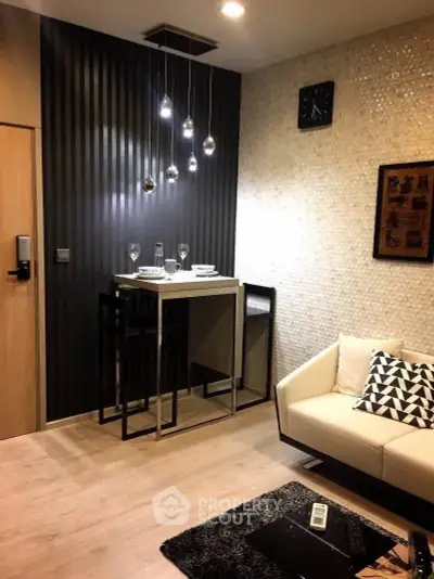 Stylish modern living room with elegant lighting and cozy seating area.