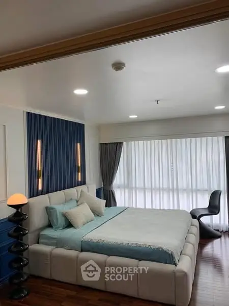 Luxurious modern bedroom with stylish decor and natural light