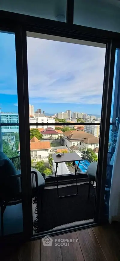 Charming balcony view with cityscape, perfect for relaxing and enjoying urban living.