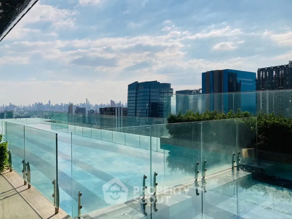 Luxurious rooftop pool with stunning city skyline views, perfect for relaxation and leisure.