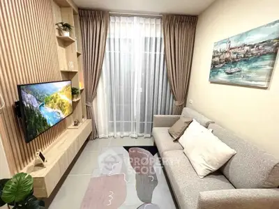 Cozy living room with modern decor, wall-mounted TV, and elegant curtains.