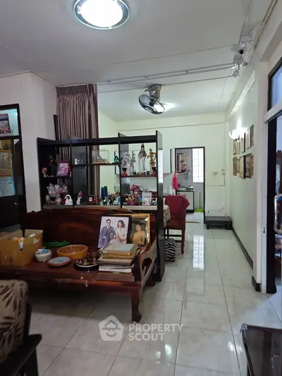 Charming living room with open layout and stylish decor, perfect for family gatherings.