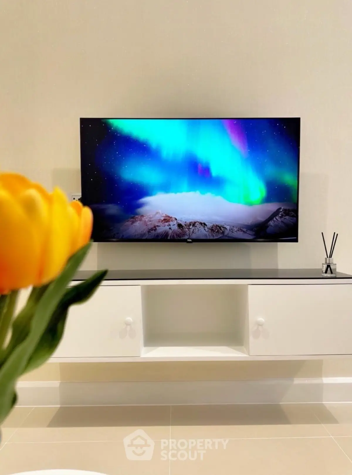 Modern living room with sleek TV and elegant decor