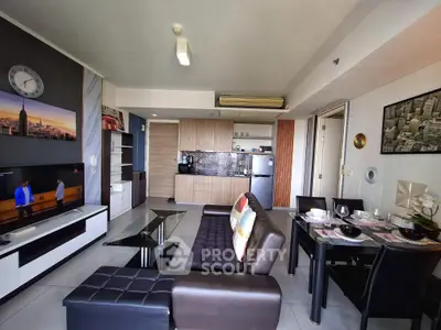 Modern living room with sleek furniture and open kitchen layout