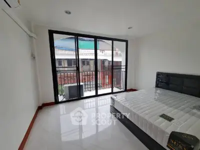 Spacious bedroom with large windows and modern design in a prime location.