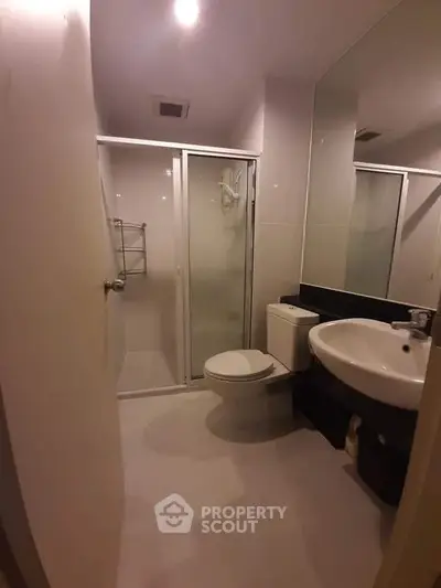 Modern bathroom with shower enclosure and sleek fixtures