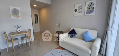 Modern living room with stylish decor and cozy seating area, perfect for relaxation.