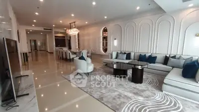 Luxurious modern living room with elegant decor and spacious seating area.