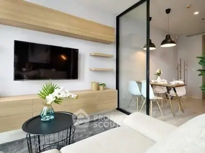Modern living room with sleek furniture and open dining area, perfect for contemporary living.