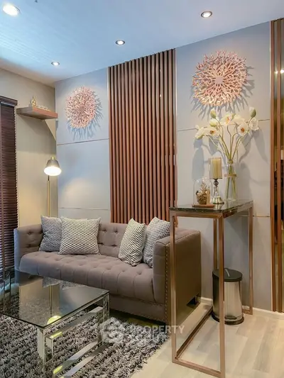 Elegant living room with modern decor, plush sofa, and stylish lighting in a cozy apartment setting.