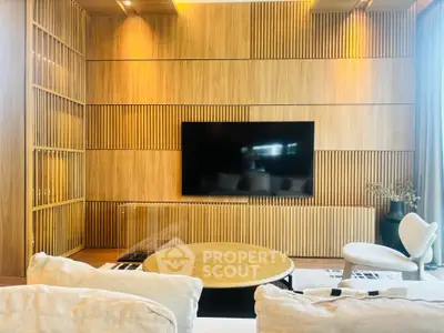 Modern living room with wooden panel wall and sleek TV setup