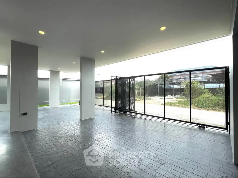 Spacious modern parking area with sleek design and ample natural light.