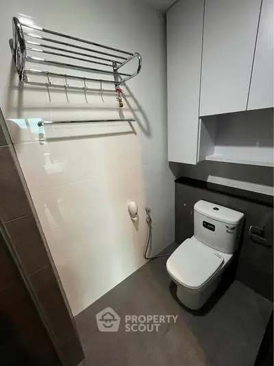 Modern bathroom with sleek fixtures and ample storage space