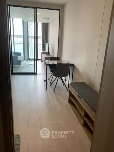 Modern apartment interior with glass partition and stylish furniture