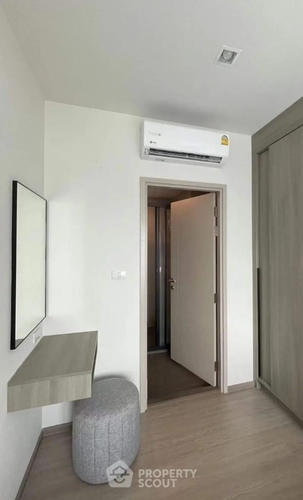 Modern minimalist room with air conditioning and sleek furniture