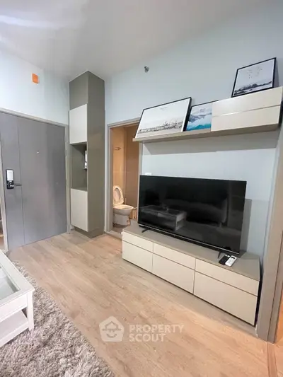 Modern living room with sleek TV unit and cozy decor