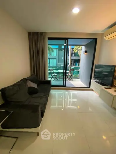 Modern living room with balcony view and sleek furnishings