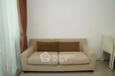 Modern living room with beige sofa and elegant curtains