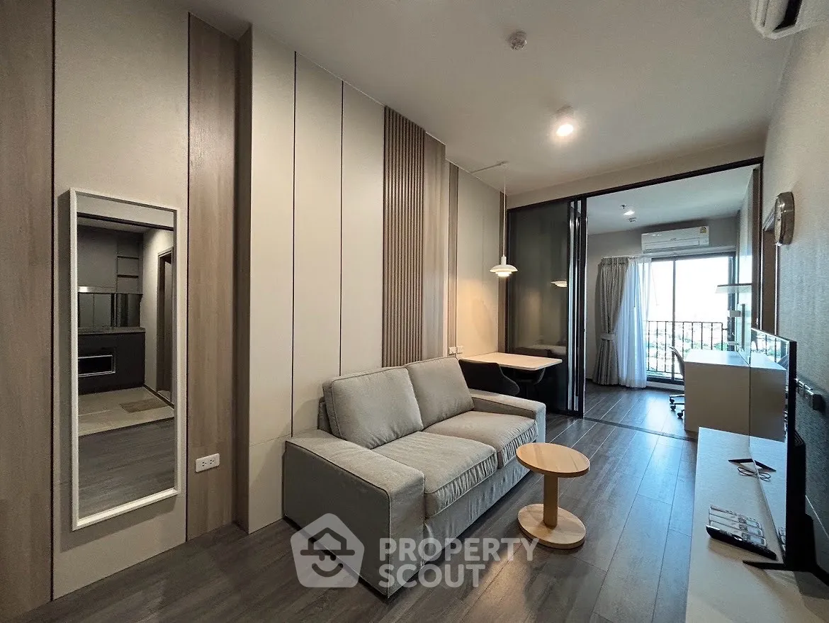 Modern living room with sleek design and balcony view