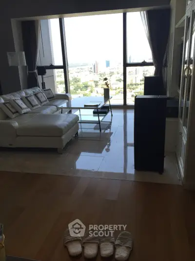 Luxurious living room with stunning city view and elegant white sofa