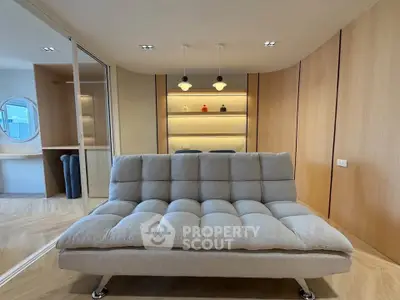 Modern living room with stylish sofa and elegant wooden paneling