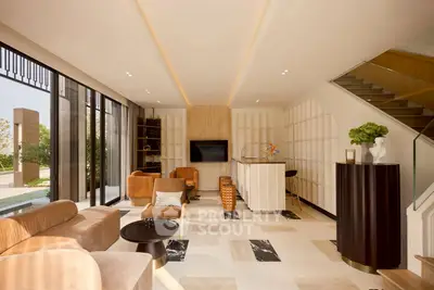 Luxurious modern living room with elegant furniture and large windows