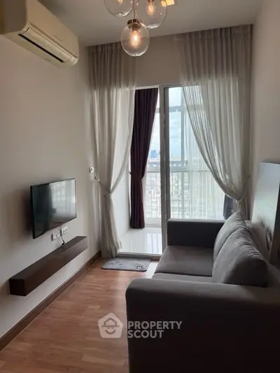 Modern living room with sleek design and city view balcony access.