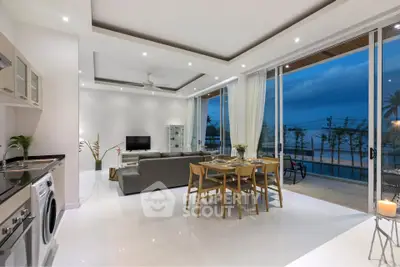 Luxurious open-plan living room with ocean view and modern furnishings