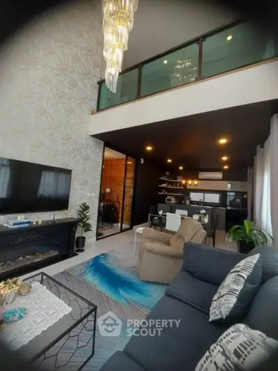 Luxurious modern living room with high ceiling and elegant chandelier