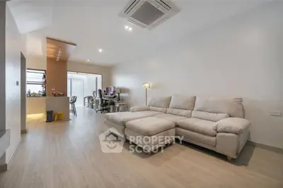 Spacious modern living room with cozy sectional sofa and open layout