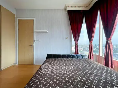 Stylish bedroom with panoramic city view and elegant red curtains