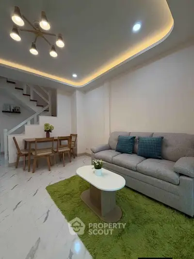 Modern living room with stylish furniture and elegant lighting