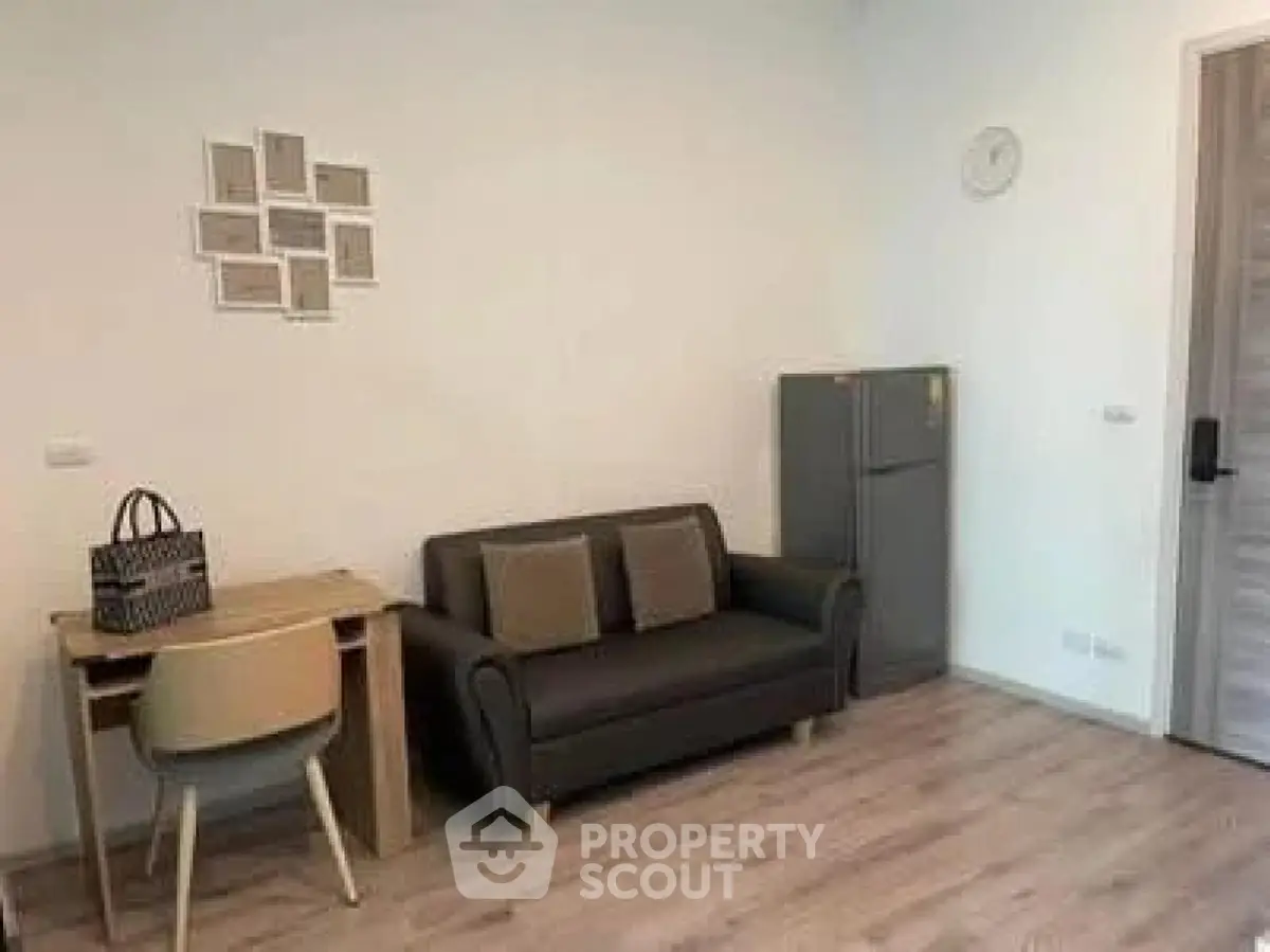 Cozy living room with modern decor and compact furniture setup