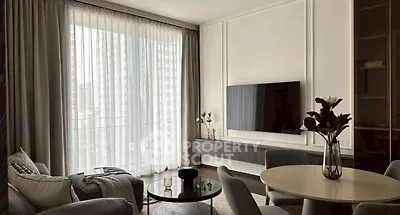 Elegant living room with modern decor and large window view