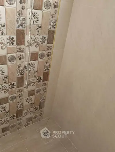 Modern bathroom with stylish tile design and sleek shower area
