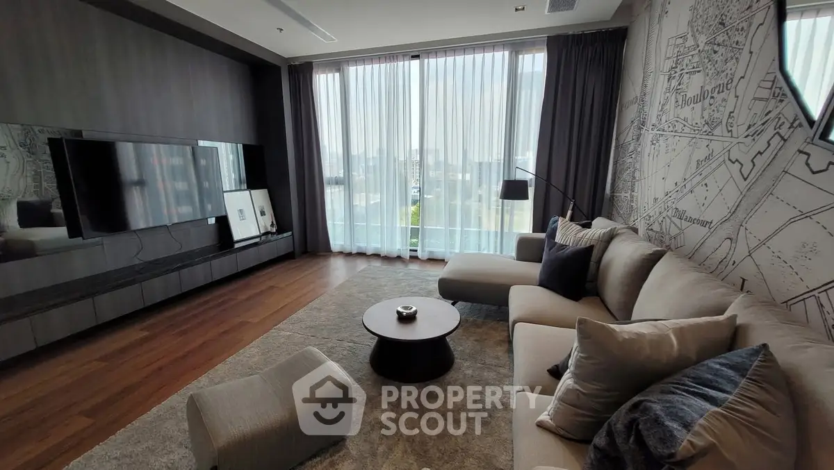 Luxurious modern living room with floor-to-ceiling windows and stylish decor.