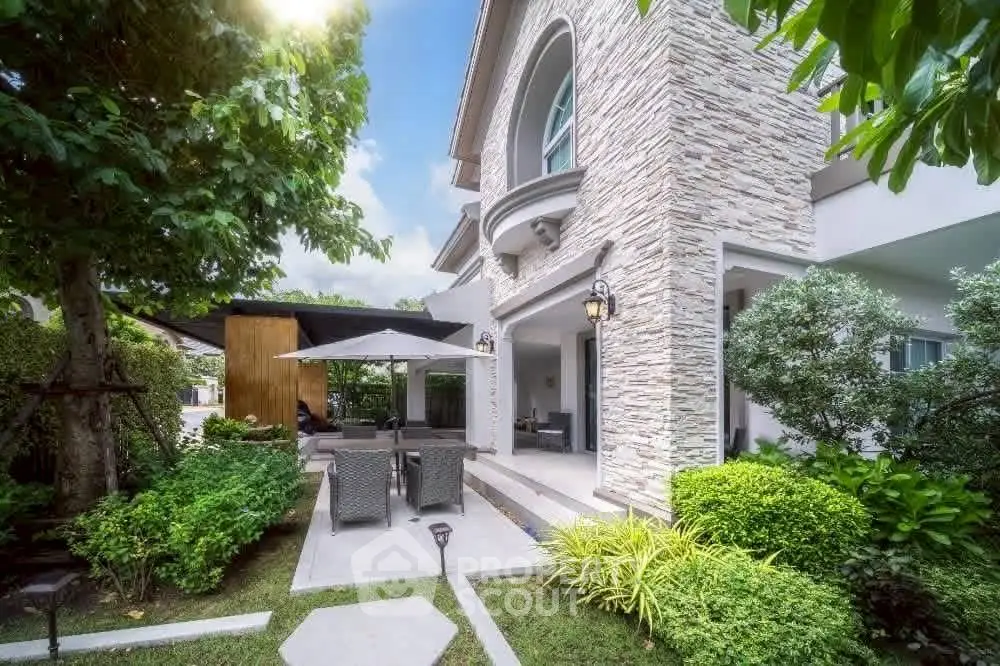 Charming suburban home with lush garden and stylish patio area, perfect for outdoor relaxation.