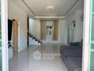 Spacious modern living room with sleek design and natural light
