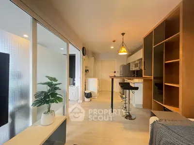 Modern open-layout kitchen with stylish bar seating and sleek cabinetry