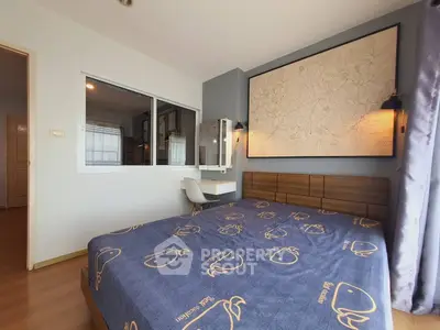 Cozy bedroom with modern decor and large wall art, featuring a comfortable bed and stylish lighting.