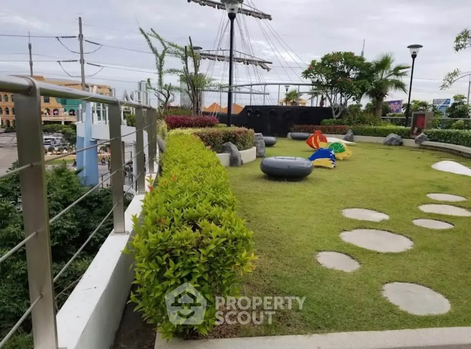 Charming rooftop garden with playful pirate ship theme and lush greenery.