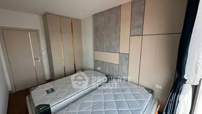 Modern bedroom with twin beds and stylish wardrobes, perfect for comfortable living.
