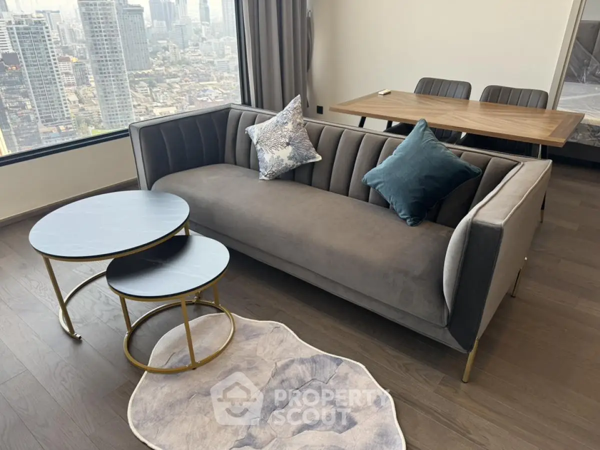 Modern living room with stylish sofa and city view from large window