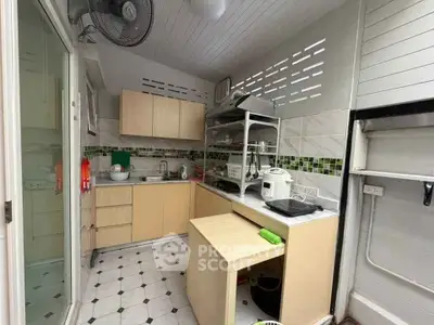 Charming kitchen with modern appliances and open layout, perfect for culinary enthusiasts.
