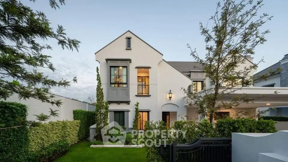 Elegant modern house with manicured garden and stylish architecture, perfect for luxury living.