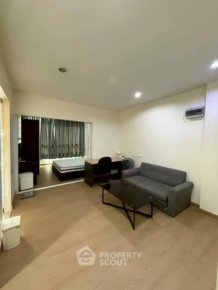 Spacious studio apartment with modern furnishings and open layout