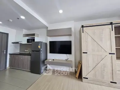 Modern apartment interior with sleek kitchen and stylish wooden accents